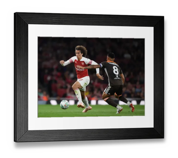 Framed Print : Arsenal's Guendouzi Clashes with Brentford's Yennaris in Carabao Cup Showdown Framed Print : Arsenal's Guendouzi Clashes with Brentford's Yennaris in Carabao Cup Showdown