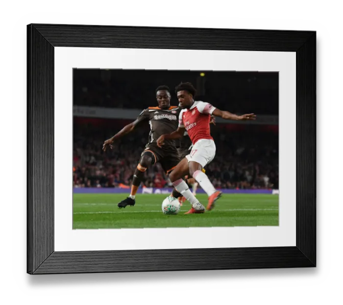 Framed Print : Arsenal's Alex Iwobi Outmaneuvers Brentford's Moses Odubajo in Carabao Cup Clash Framed Print : Arsenal's Alex Iwobi Outmaneuvers Brentford's Moses Odubajo in Carabao Cup Clash