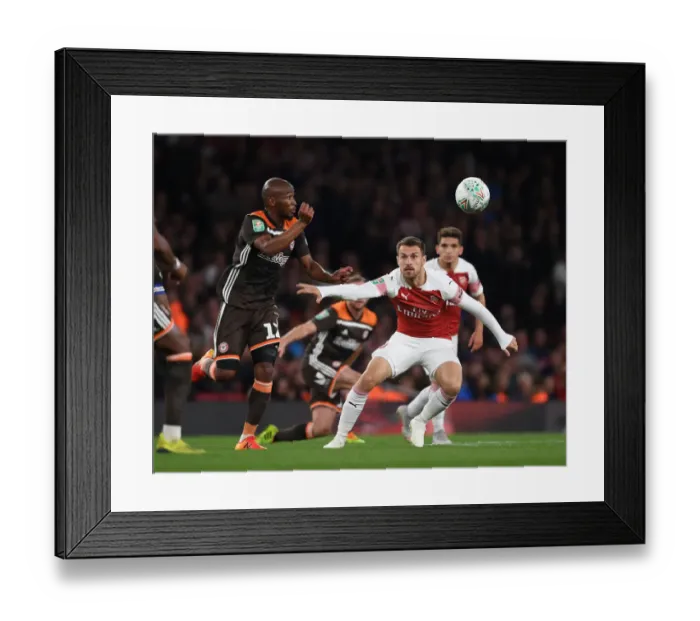 Framed Print : Clash of Midfield Titans: Aaron Ramsey vs. Kamohelo Mokotjo in Arsenal's Carabao Cup Battle Framed Print : Clash of Midfield Titans: Aaron Ramsey vs. Kamohelo Mokotjo in Arsenal's Carabao Cup Battle