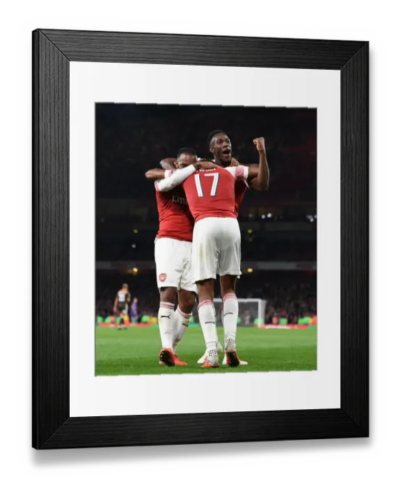 Framed Print : Arsenal's Lacazette, Iwobi, and Welbeck Celebrate Goals Against Brentford in Carabao Cup