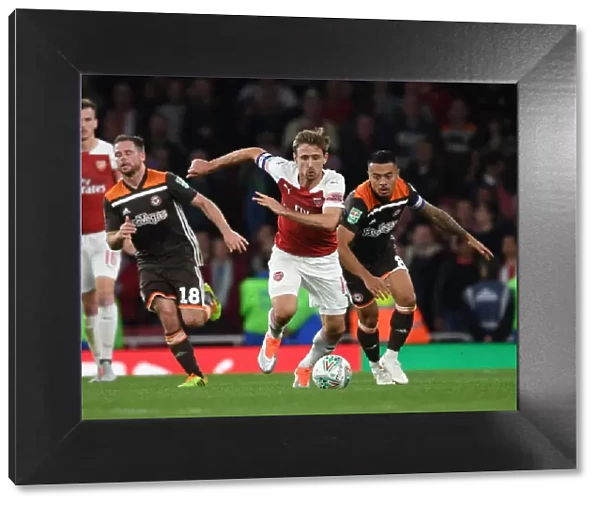 Monreal Overpowers Yennaris: Arsenal vs. Brentford in Carabao Cup