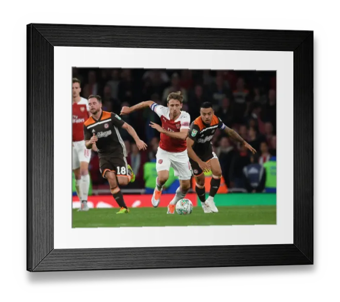 Framed Print : Monreal Overpowers Yennaris: Arsenal vs. Brentford in Carabao Cup Framed Print : Monreal Overpowers Yennaris: Arsenal vs. Brentford in Carabao Cup