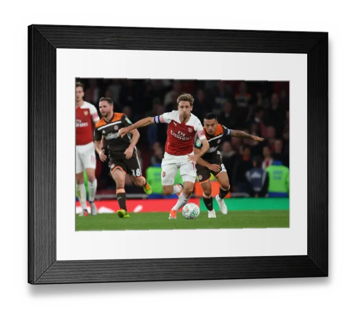 Framed Print : Monreal's Powerful Performance: Arsenal's Carabao Cup Victory over Brentford