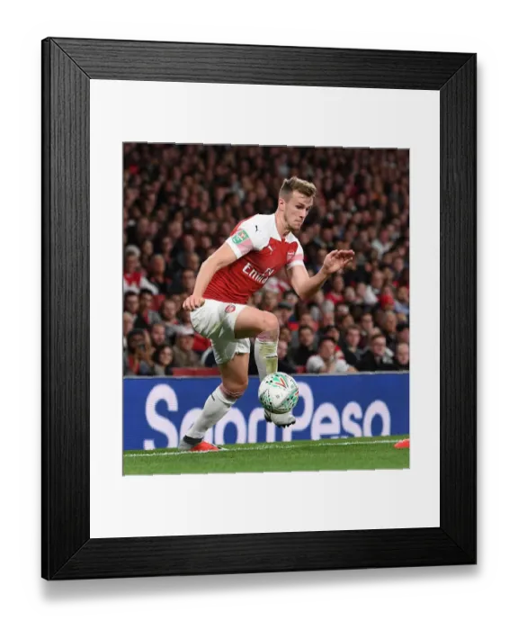 Framed Print : Rob Holding Focuses in Arsenal's Carabao Cup Clash Against Brentford Framed Print : Rob Holding Focuses in Arsenal's Carabao Cup Clash Against Brentford