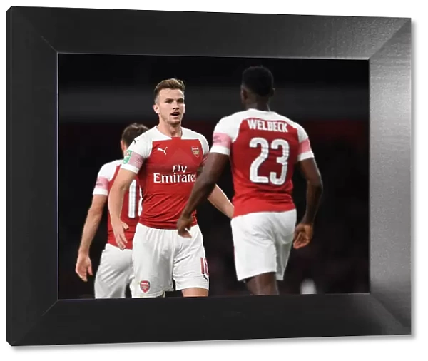 Arsenal's Danny Welbeck and Rob Holding Celebrate First Goal vs. Brentford in Carabao Cup