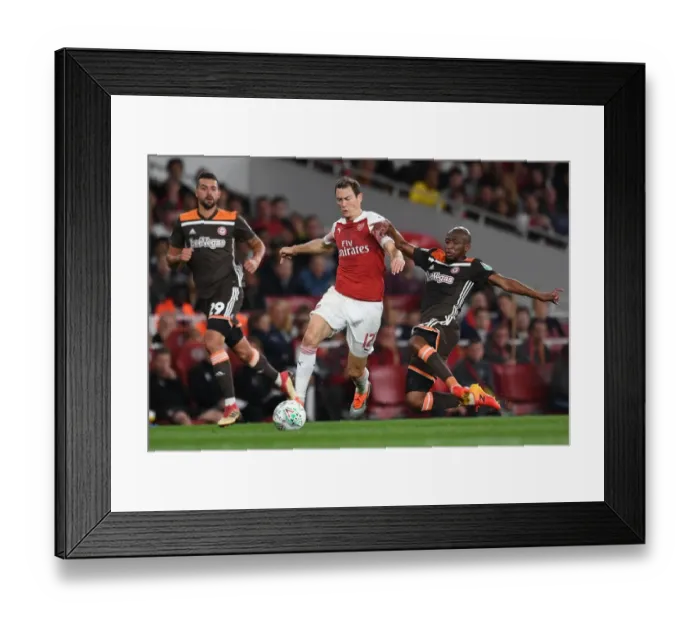 Framed Print : Arsenal's Lichtsteiner Clashes with Mokotjo in Carabao Cup Showdown Framed Print : Arsenal's Lichtsteiner Clashes with Mokotjo in Carabao Cup Showdown