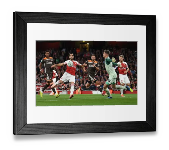 Framed Print : Mkhitaryan vs Daniels: Intense Moment from Arsenal's Carabao Cup Clash with Brentford Framed Print : Mkhitaryan vs Daniels: Intense Moment from Arsenal's Carabao Cup Clash with Brentford