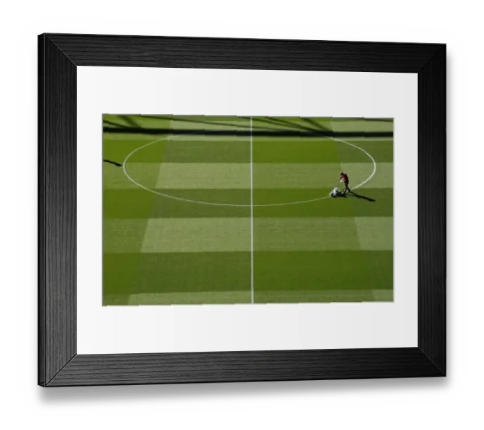 Framed Print : Arsenal's Groundsman Prepares Pitch for Carabao Cup Clash Against Brentford Framed Print : Arsenal's Groundsman Prepares Pitch for Carabao Cup Clash Against Brentford