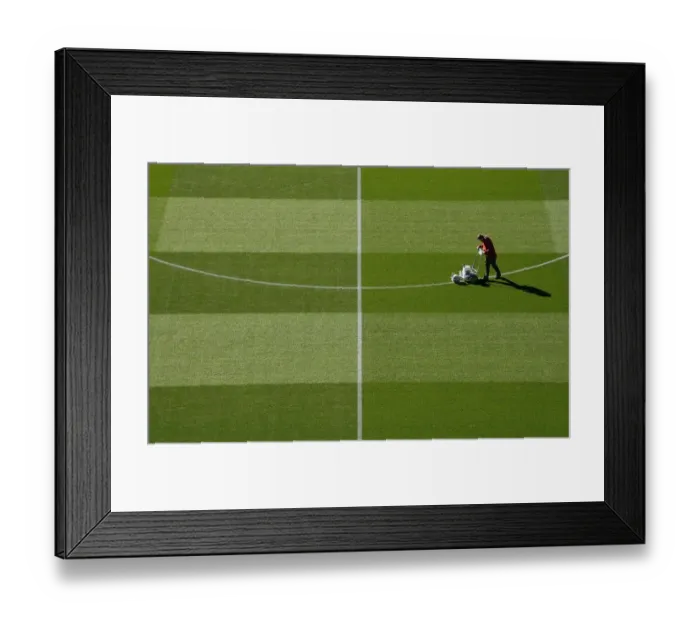 Framed Print : Arsenal Groundsman Meticulously Prepares Carabao Cup Pitch for Arsenal vs. Brentford