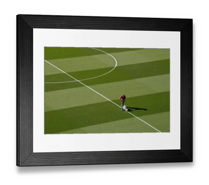 Framed Print : Arsenal Groundsman Meticulously Prepares Emirates Stadium Pitch for Carabao Cup Match Framed Print : Arsenal Groundsman Meticulously Prepares Emirates Stadium Pitch for Carabao Cup Match