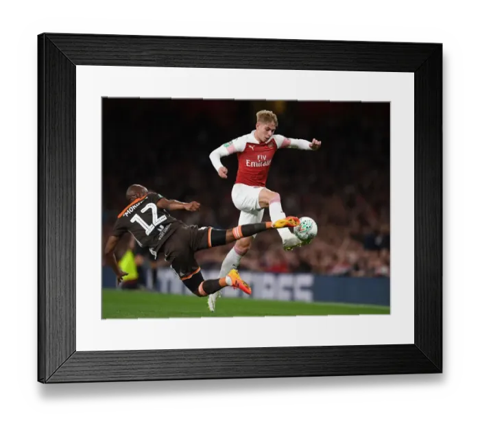 Framed Print : Arsenal's Emile Smith Rowe Clashes with Brentford's Kamohelo Mokotjo in Carabao Cup Showdown Framed Print : Arsenal's Emile Smith Rowe Clashes with Brentford's Kamohelo Mokotjo in Carabao Cup Showdown