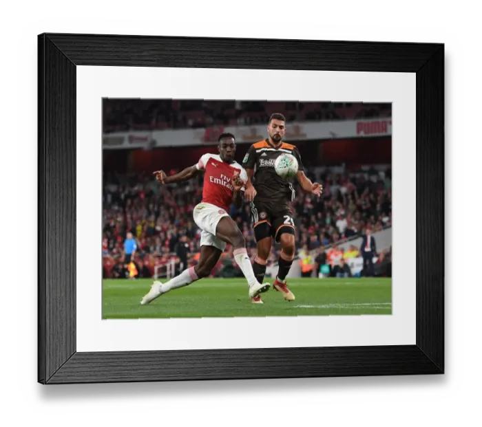 Framed Print : Arsenal's Danny Welbeck Faces Off Against Brentford's Ezri Konsa in Carabao Cup Clash Framed Print : Arsenal's Danny Welbeck Faces Off Against Brentford's Ezri Konsa in Carabao Cup Clash