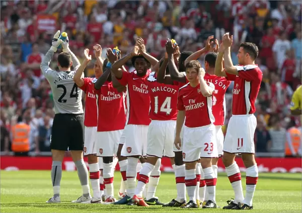 The Arsenal Players clap the fans before the match