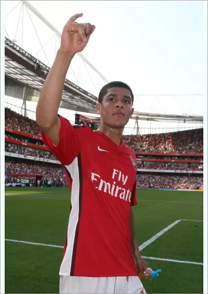 Denilson (Arsenal) waves to the fans after the match