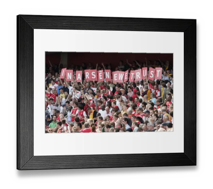 Framed Print : Arsenal fans hold up a sign in support of Arsene Wenger