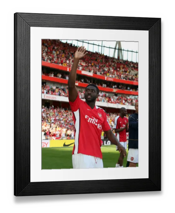 Framed Print : Kolo Toure (Arsenal) waves to the fans after the match