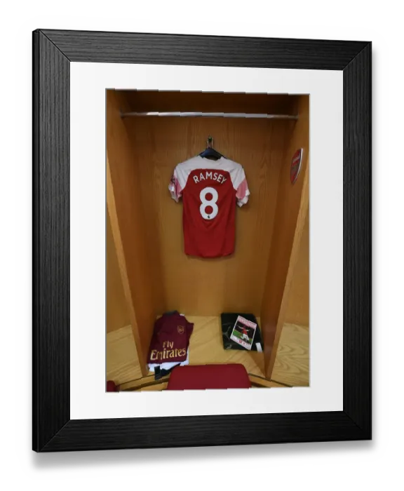 Framed Print : Arsenal FC: Aaron Ramsey's Empty Jersey in the Changing Room Before Arsenal v Watford (2018-19)