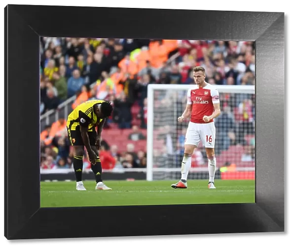 Rob Holding's Celebration: Arsenal FC Beats Watford FC in Premier League Thriller