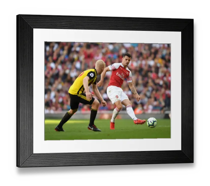 Framed Print : Clash of Midfielders: Xhaka vs Hughes in Arsenal's Battle Against Watford