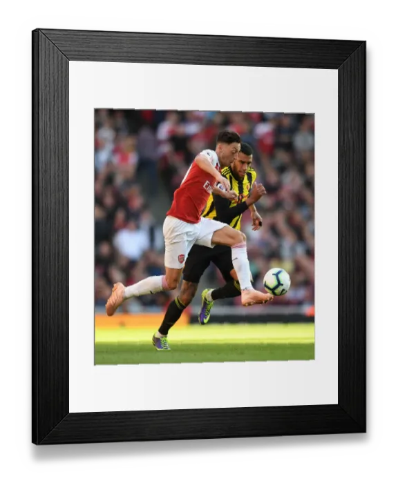 Framed Print : Ozil vs. Capoue: A Football Battle at the Emirates - Arsenal vs. Watford, Premier League 2018-19