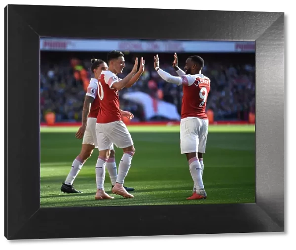 Mesut Ozil and Alexandre Lacazette Celebrate Goals: Arsenal's Winning Moment Against Watford (2018-19)