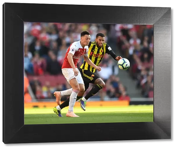 Mesut Ozil vs. Etienne Capoue: A Battle in the Arsenal v Watford Premier League Clash