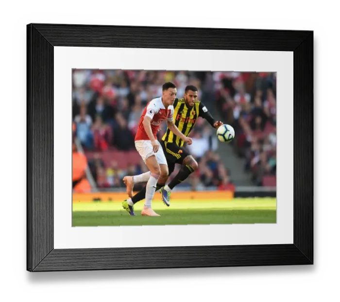 Framed Print : Mesut Ozil vs. Etienne Capoue: A Battle in the Arsenal v Watford Premier League Clash Framed Print : Mesut Ozil vs. Etienne Capoue: A Battle in the Arsenal v Watford Premier League Clash