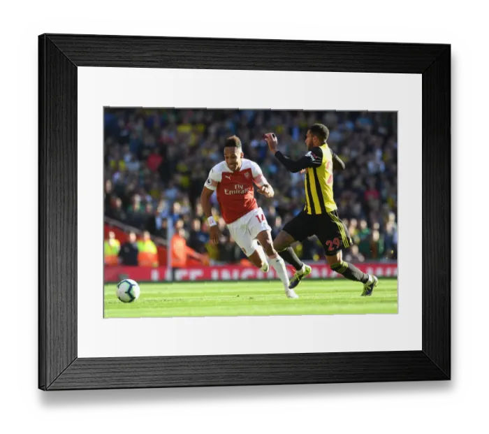 Framed Print : Arsenal's Aubameyang Faces Off Against Watford's Capoue in Premier League Clash