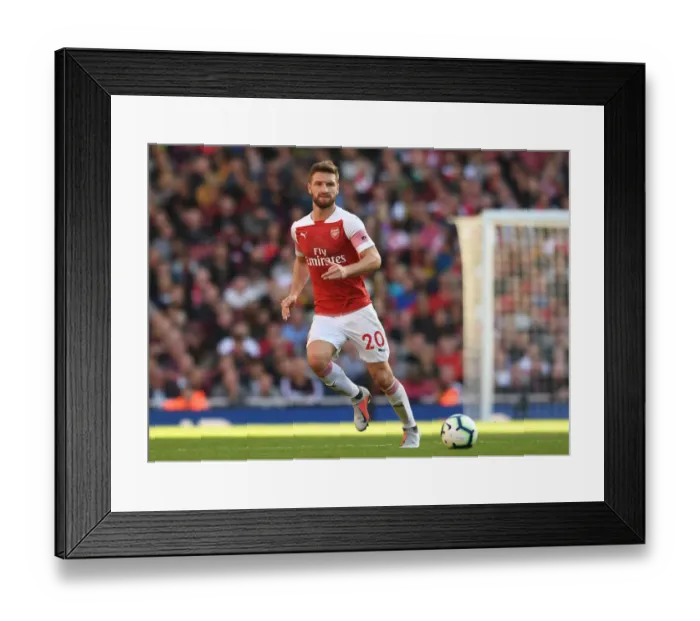 Framed Print : Shkodran Mustafi Focuses in Arsenal's Battle Against Watford (2018-19)