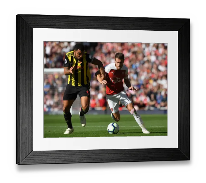 Framed Print : Arsenal's Ramsey Clashes with Watford's Deeney in Premier League Showdown