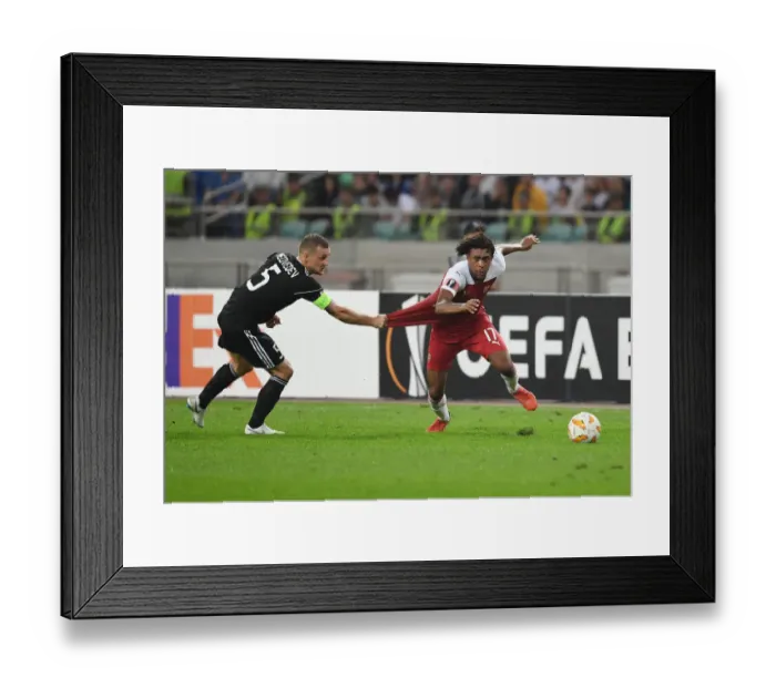 Framed Print : Clash of Players: Alex Iwobi vs. Maksim Medvedev in Qarabag vs. Arsenal Europa League Match