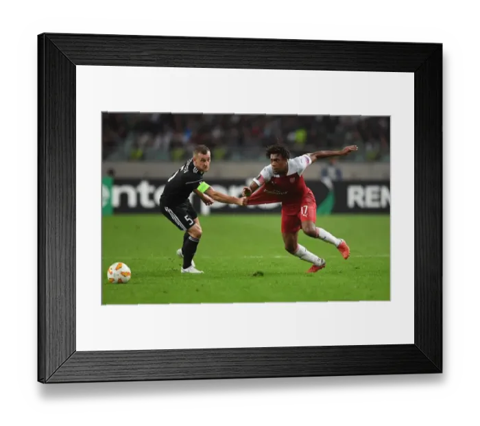 Framed Print : Arsenal's Mohamed Elneny Faces Off Against Qarabag's Mikael in Europa League Clash