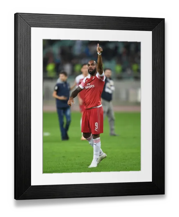 Framed Print : Alexandre Lacazette's Thumbs-Up: Arsenal's Europa League Victory over Qarabag FK in Baku