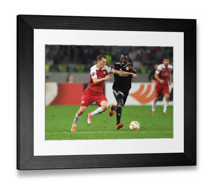 Framed Print : Stephan Lichtsteiner vs Con Delari: Clash in UEFA Europa League Match between Qarabag and Arsenal