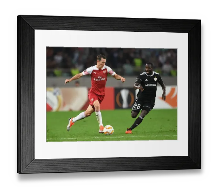 Framed Print : Stephan Lichtsteiner vs Con Delari: A Battle in Arsenal's Europa League Clash against Qarabag