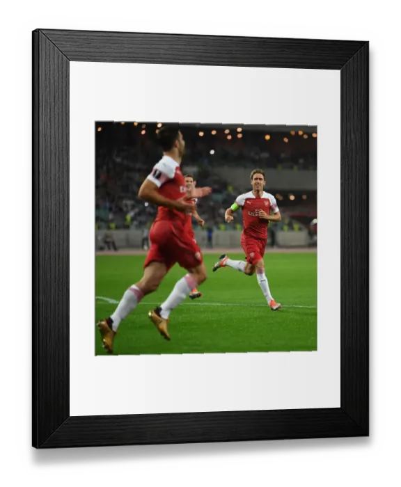 Framed Print : Nacho Monreal Celebrates Arsenal's First Goal Against Qarabag FK in Europa League Match