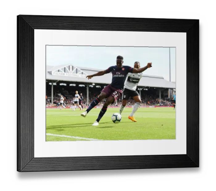 Framed Print : Danny Welbeck vs Denis Odoi: Battle at Craven Cottage - Fulham vs Arsenal, Premier League 2018-19