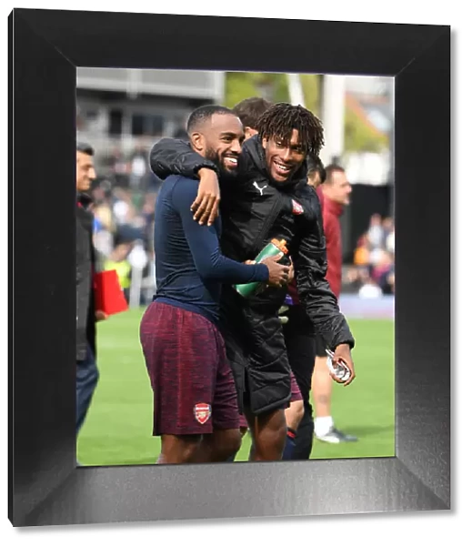 Celebrating Victory: Lacazette and Iwobi Rejoice After Arsenal's Win Against Fulham