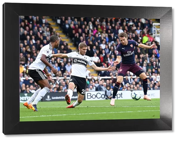 Aaron Ramsey Scores Third Goal Against Fulham Amid Pressure from Maxime Le Marchand