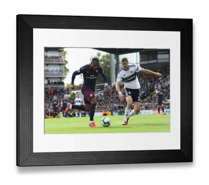 Framed Print : Lacazette vs. Le Marchand: A Premier League Showdown at Craven Cottage
