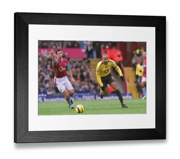 Framed Print : Thierry Henry (Arsenal) Mark Delaney (Aston Villa). Aston Villa 0: 0 Arsenal Framed Print : Thierry Henry (Arsenal) Mark Delaney (Aston Villa). Aston Villa 0: 0 Arsenal
