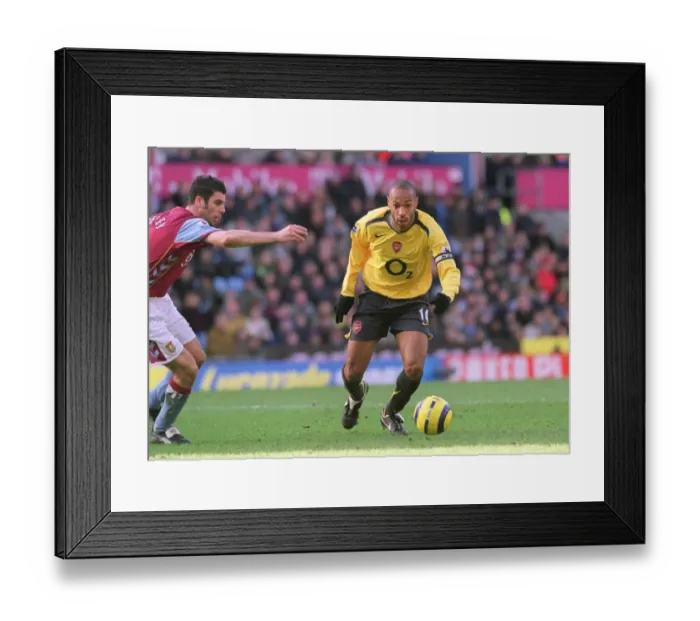 Framed Print : Thierry Henry vs Mark Delaney: A Battle at Villa Park, Arsenal vs Aston Villa, FA Premiership, 31 / 12 / 05 Framed Print : Thierry Henry vs Mark Delaney: A Battle at Villa Park, Arsenal vs Aston Villa, FA Premiership, 31 / 12 / 05