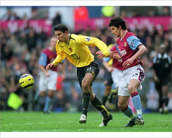 Robin van Persie (Arsenal) Liam Ridgewell (Villa). Aston Villa 0: 0 Arsenal