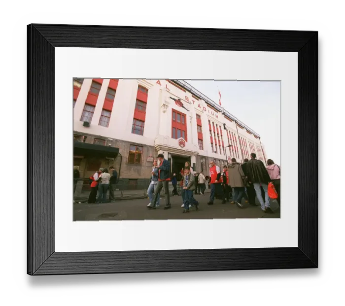 Framed Print : Arsenal fans walk outside the East Stand before the match Framed Print : Arsenal fans walk outside the East Stand before the match