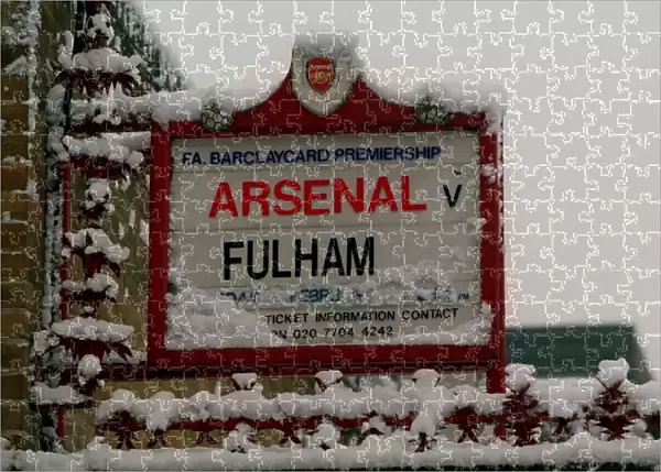 Winter's Embrace: Arsenal Stadium in a Snow-Kissed Highbury
