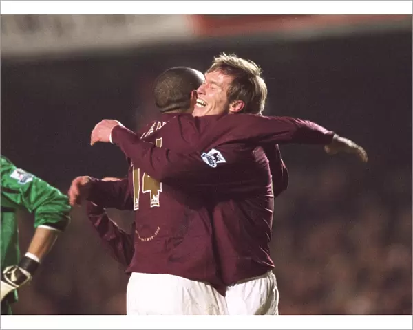 Alex Hleb celebrates scoring Arsenals 7th goal with Thierry Henry