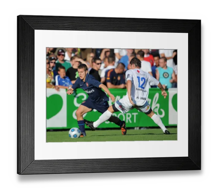 Framed Print : Arsenal's Jack Wilshere vs. SC Columbia's Alexander Frimmel: A Pre-Season Clash in Vienna, 2009 Framed Print : Arsenal's Jack Wilshere vs. SC Columbia's Alexander Frimmel: A Pre-Season Clash in Vienna, 2009