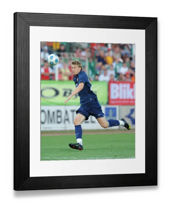Framed Print : Nicklas Bendtner's Dominant Performance: Arsenal Crushes Szombathelyi 5-0 in Pre-Season Friendly, 2009