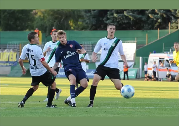 Nicklas Bendtner shoots past Szombathelyi goalkeeper