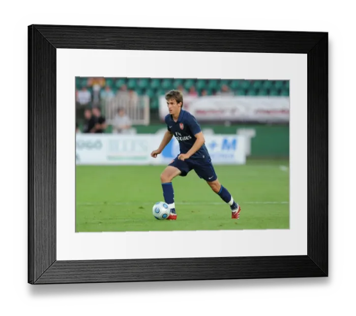Framed Print : Arsenal's Aaron Ramsey Shines: 5-0 Thrashing of Szombathelyi in 2009 Pre-Season Debut